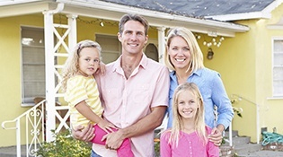 Smiling family of four