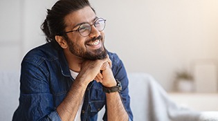 a man smiling during the adult orthodontics process