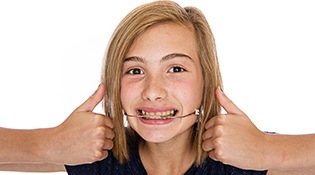 Smiling girl with headgear