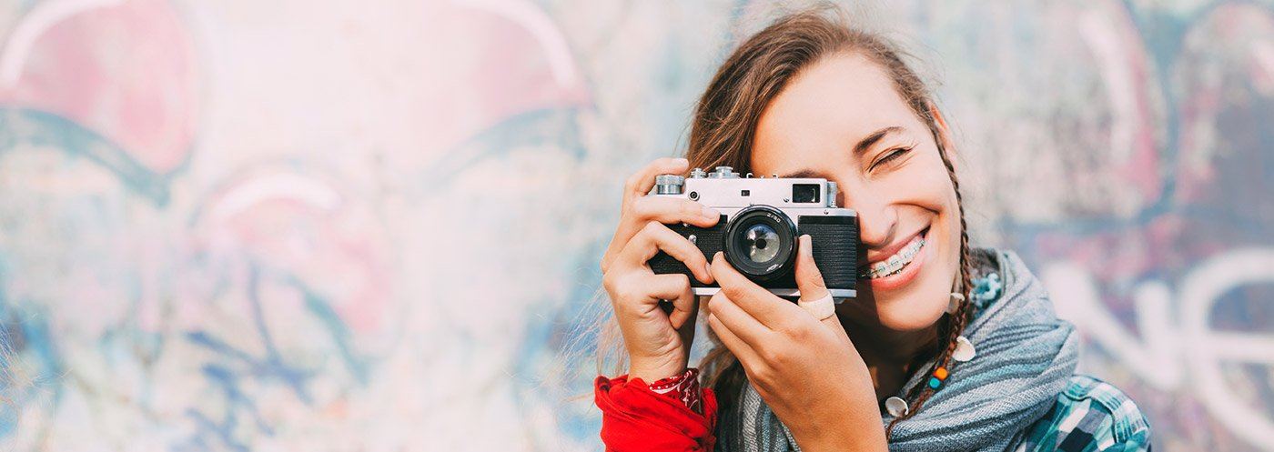 Girl with braces taking a picture