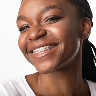 Smiling woman, happy with the cost of braces in McMurray