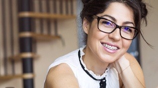 attractive woman smiling wearing braces