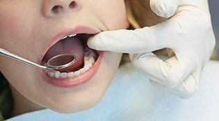 Child receiving dental exam