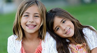 Two smiling young girls