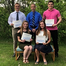 Dr. Cartwright posing with four teen award winners