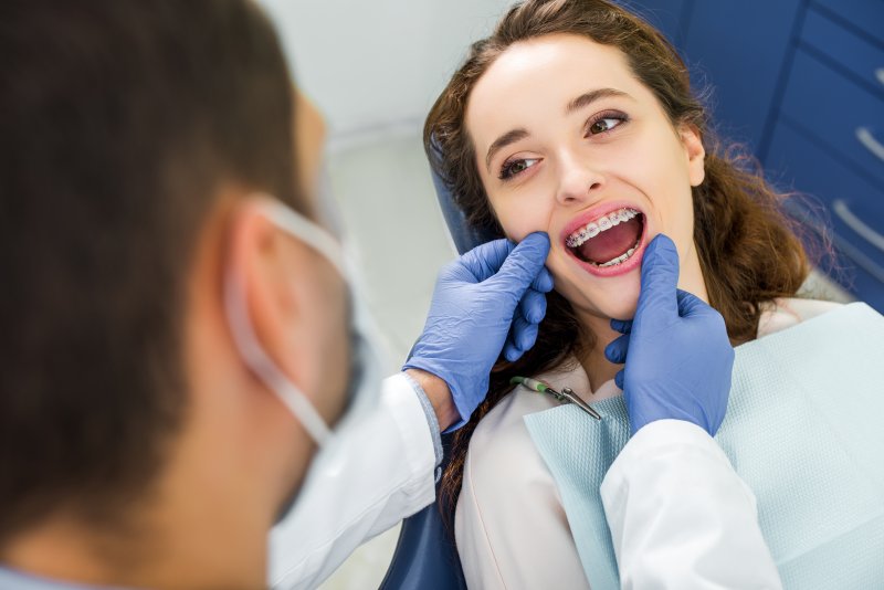 female patient with braces seeing an orthodontist